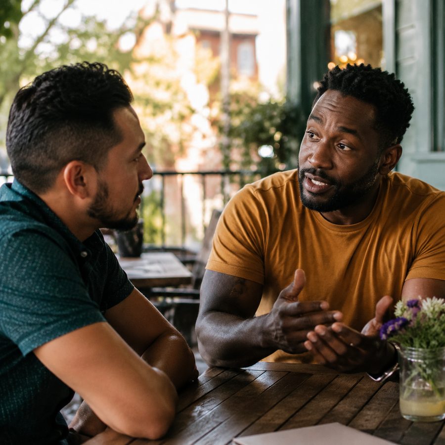 Two men in an honest, focused conversation
